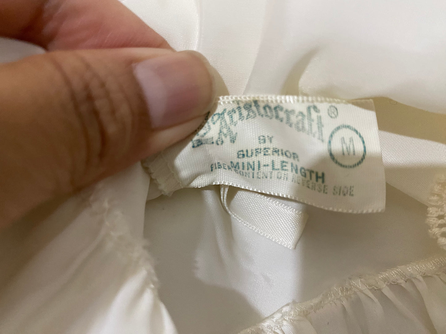 White slip with scalloped detail